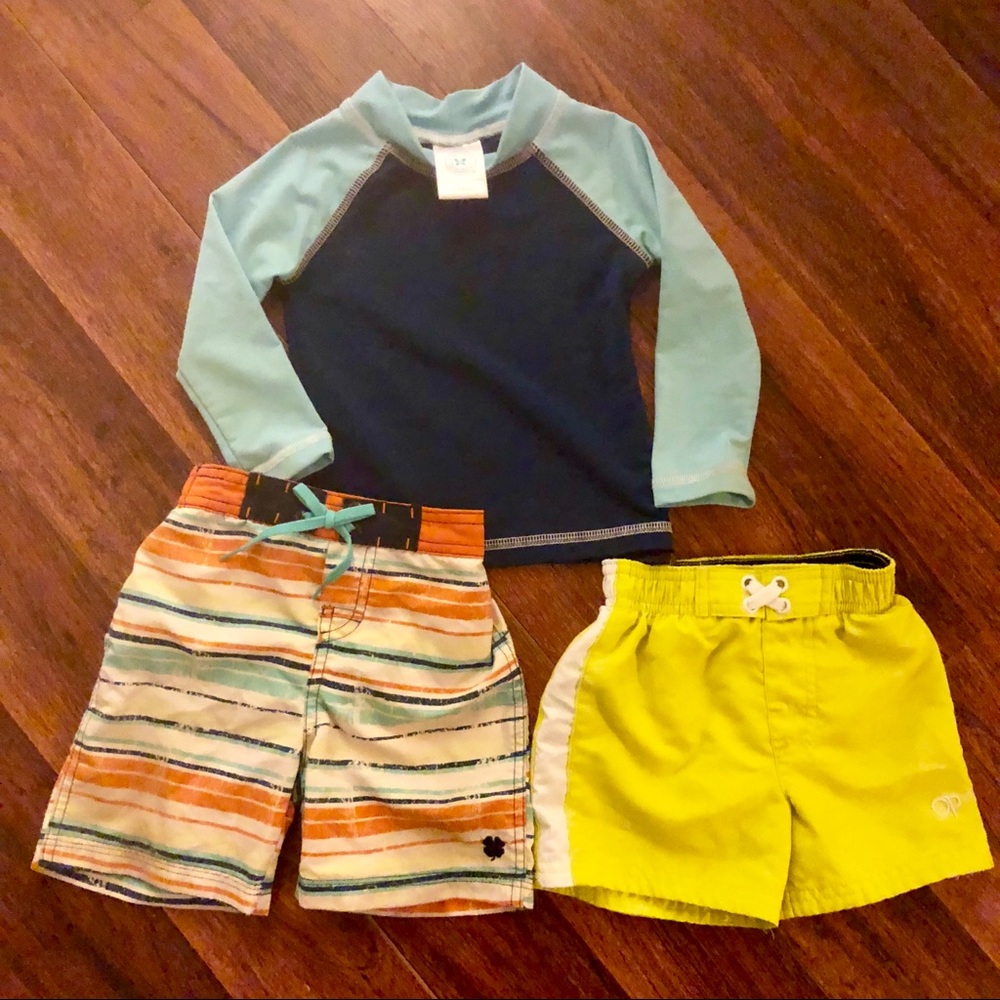 3 swim trunks and 2 rash guards. Lucky & Honest